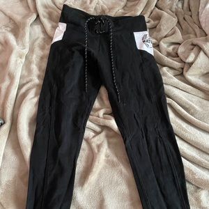 Pink Nation black lace up leggings